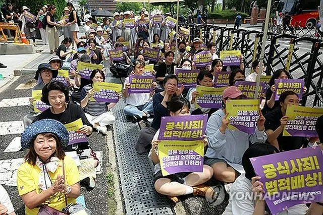 ７月２４日の水曜集会の様子＝（聯合ニュース）