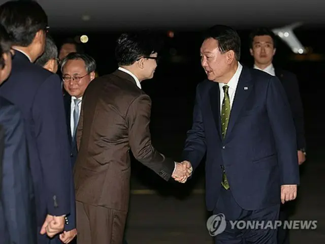 尹錫悦大統領（右）と韓東勲氏（資料写真）＝（聯合ニュース）